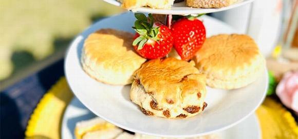 Afternoon tea scones close up on plate with strawberries