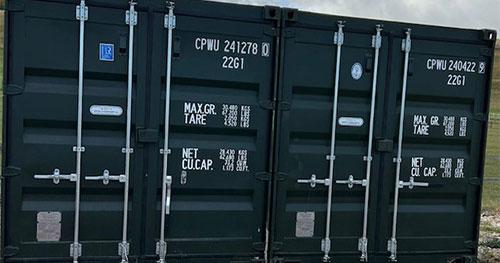 2 Storage containers next to field 